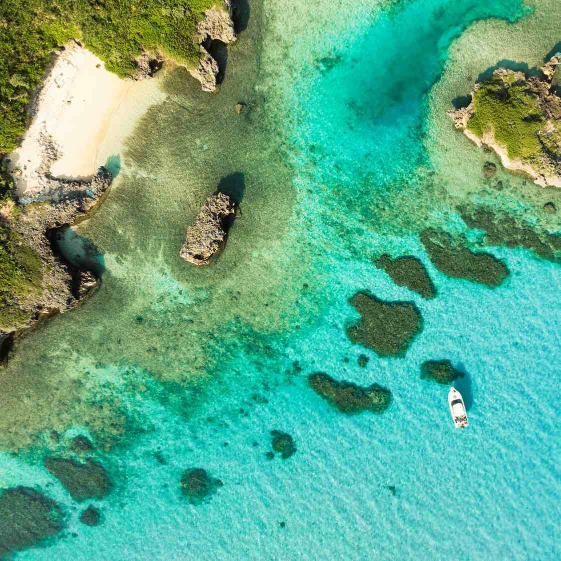 An aerial shot of the beach and ocean on Miyakojima
