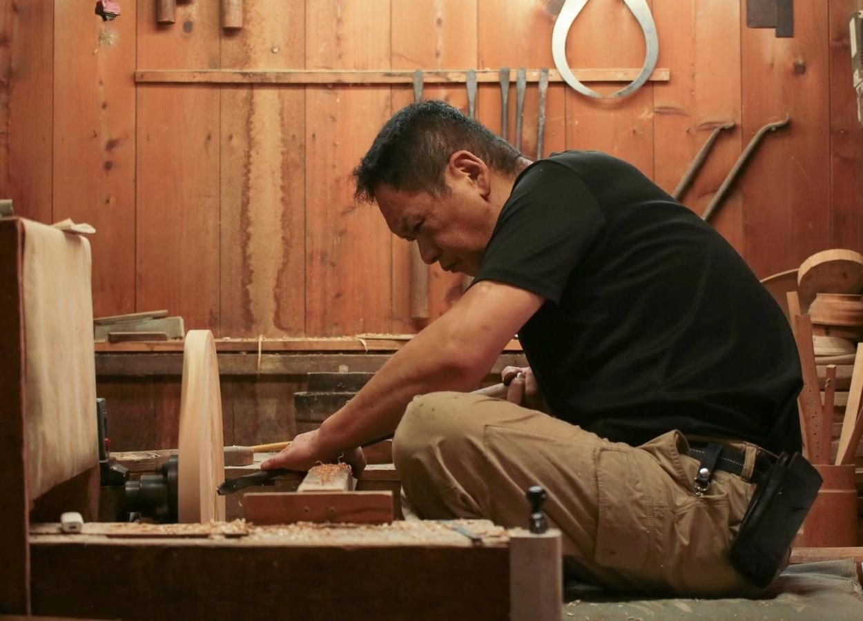 A woodturning craftsman at work
