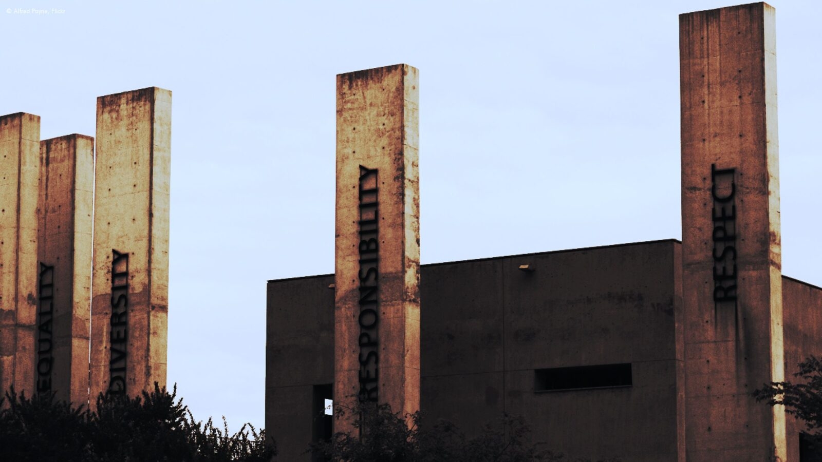 Tall concrete pillars inscribed with values like Equality and Respect on luxury Johannesburg holidays.