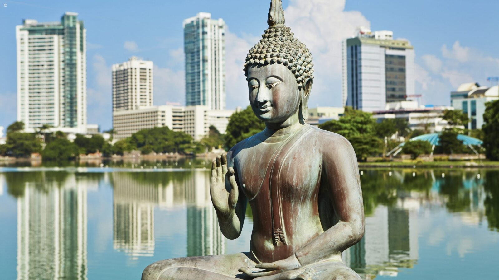 Bronze Buddha statue at Seema Malaka temple in Colombo during luxury Sri Lanka vacations.