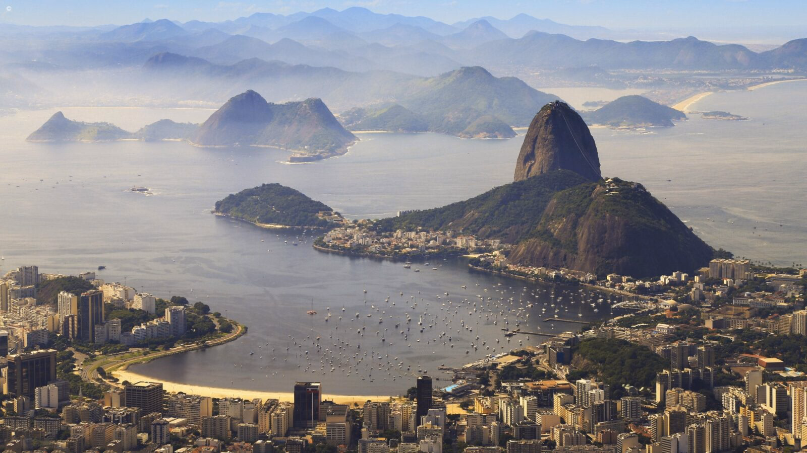 Aerial view of Sugarloaf Mountain and Guanabara Bay in Rio during luxury Latin America honeymoon tours.