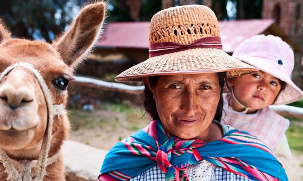 Bolivian woman carrying her baby, Isla del Sol, Bolivia