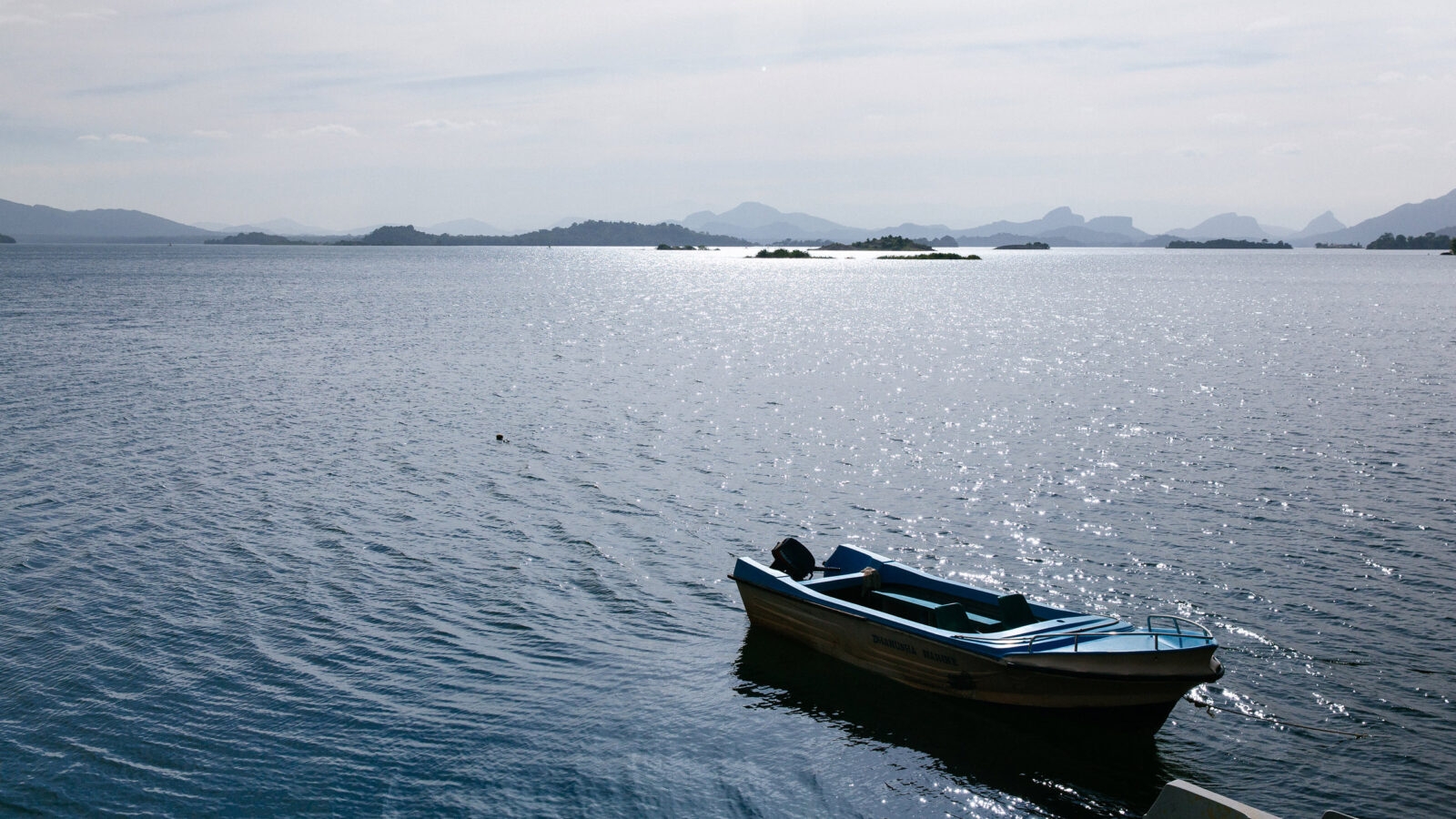 A small motorboat moored in the lake at Gal Oya National Park
