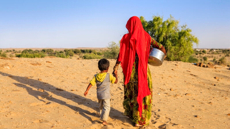 Indian woman carrying water from the well, Rajasthan