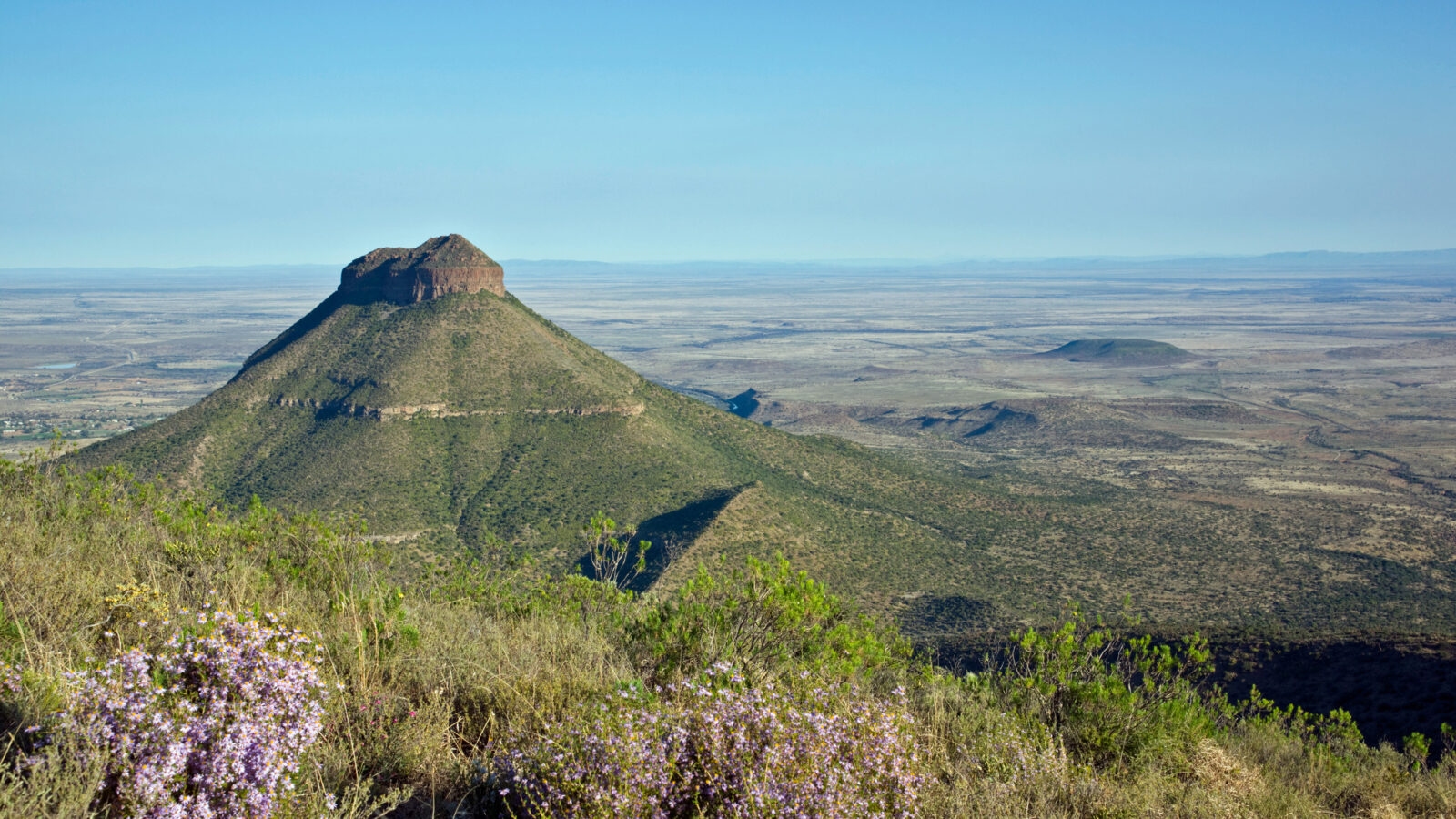 Panoramic view of a conical mountain peak in the Valley of Desolation during luxury Eastern Cape tours.