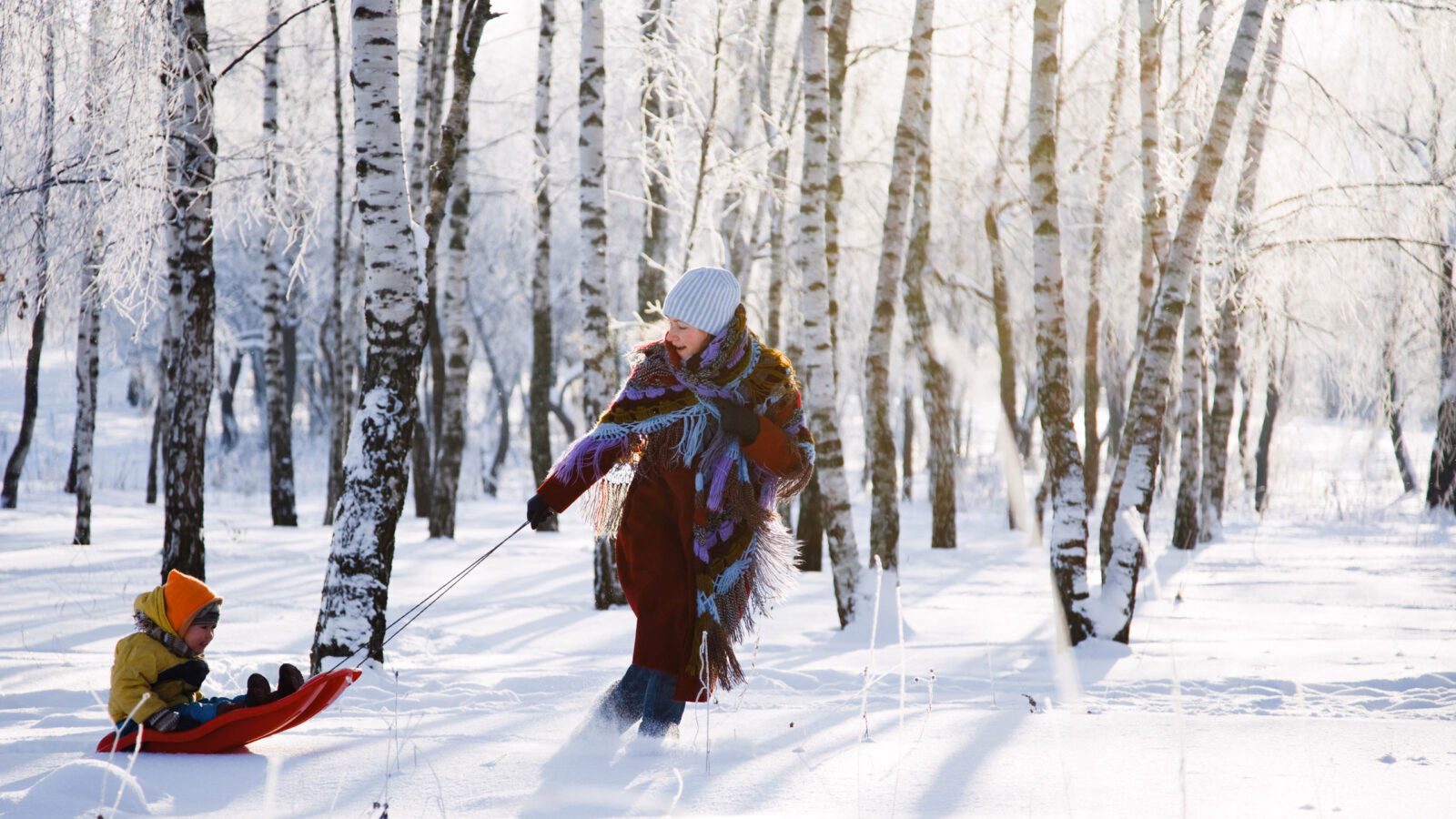 Family having fun in winter in Norway