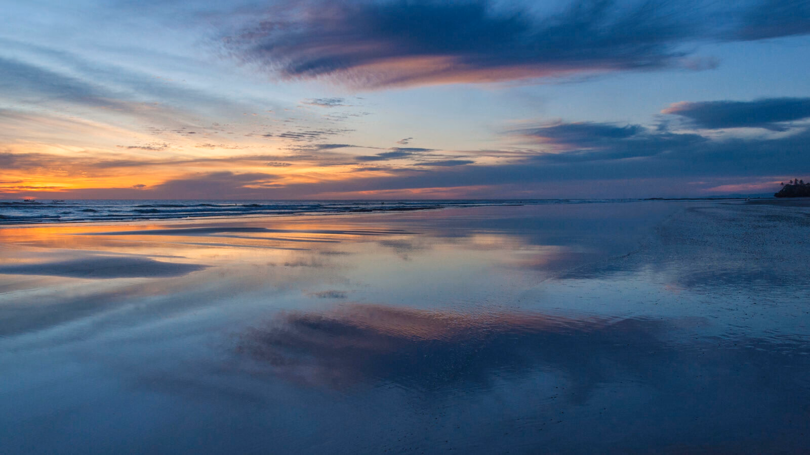 Low tide at sunset over a sandy beach