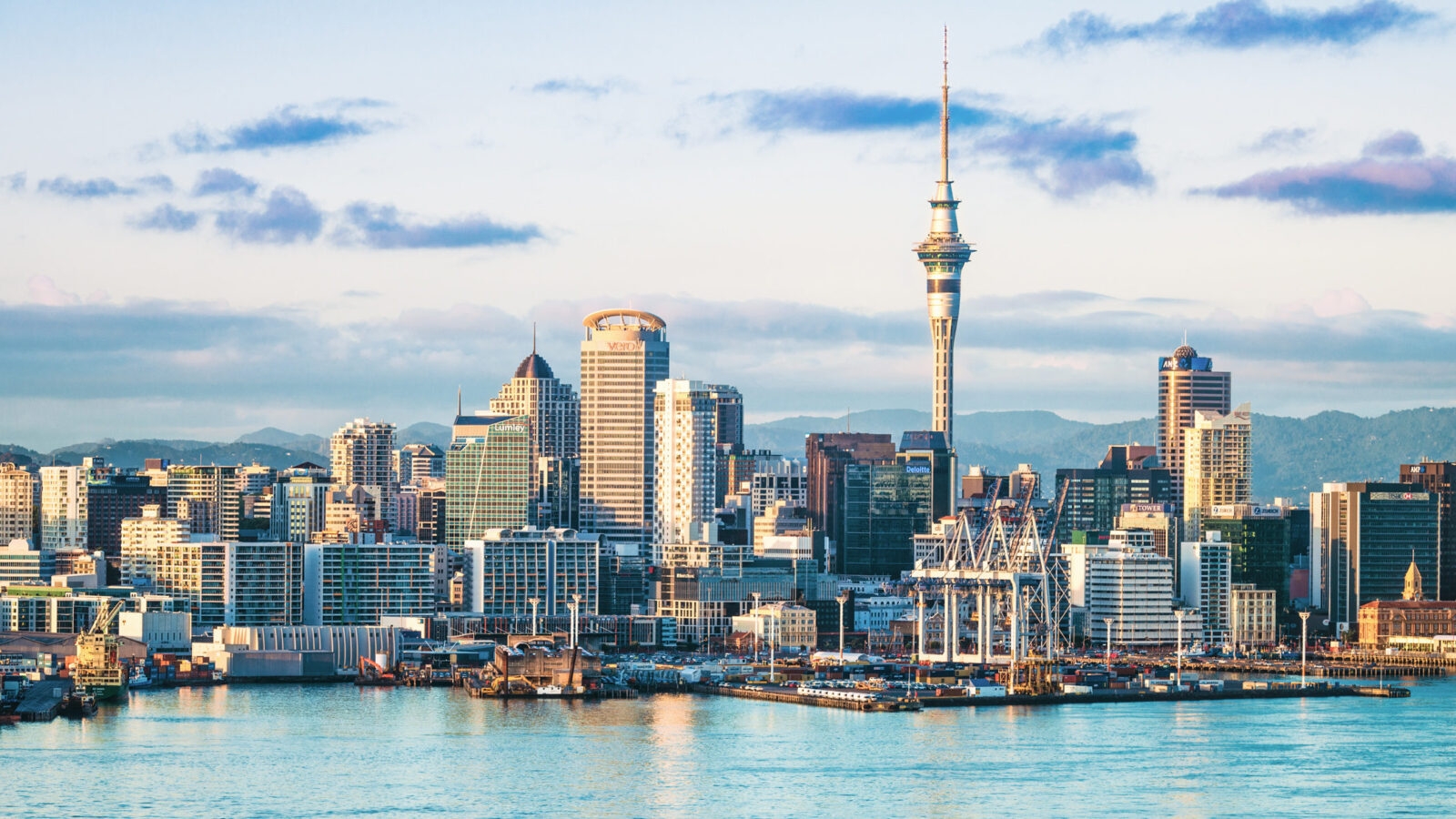 An early morning view of the CBD of Auckland, across the water of Waitemata Harbor.
