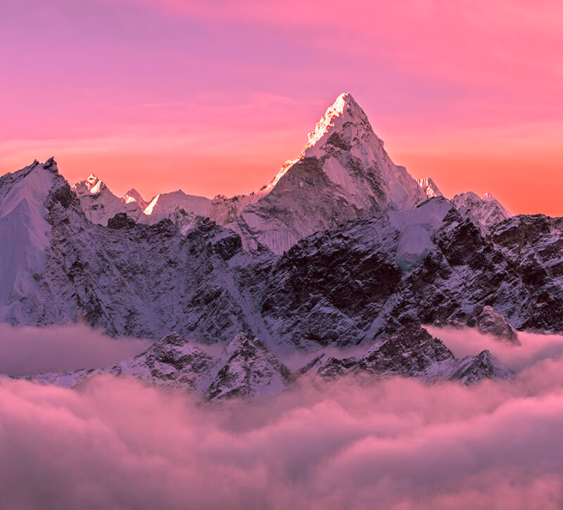 Majestic Ama Dablam peak (6856m) in the red and pink hues of sunrise - Nepal, Himalayas
