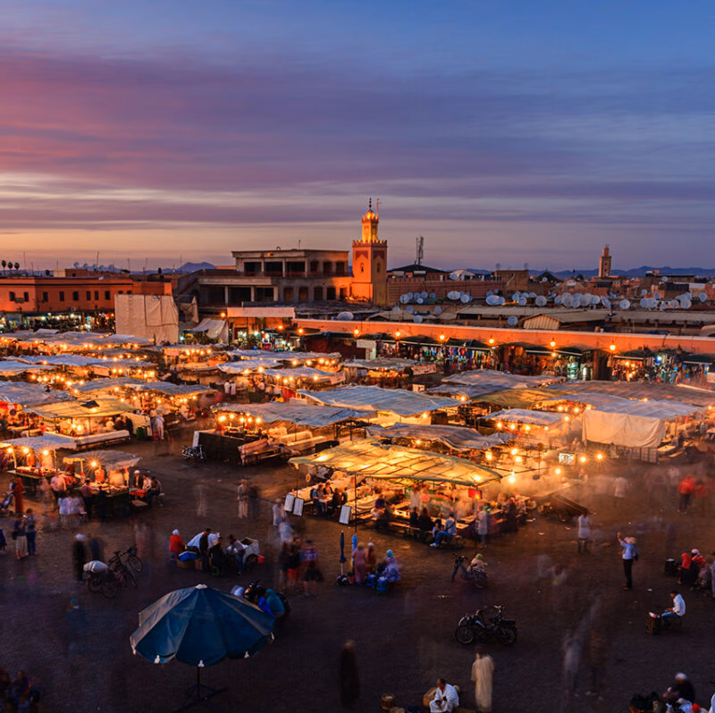 Marrakech outdoor souk with tented stalls at sunset on a luxury Morocco tour