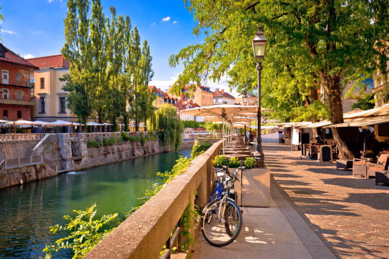 Luxury Grand Tours of Europe - Ljubljana green riverfront promenade walkway summer view