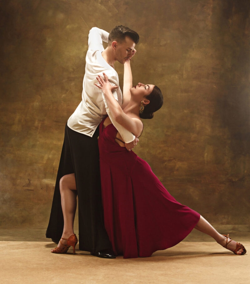 Jacada Buenos Aires - Dance ballroom couple in red dress dancing on studio background