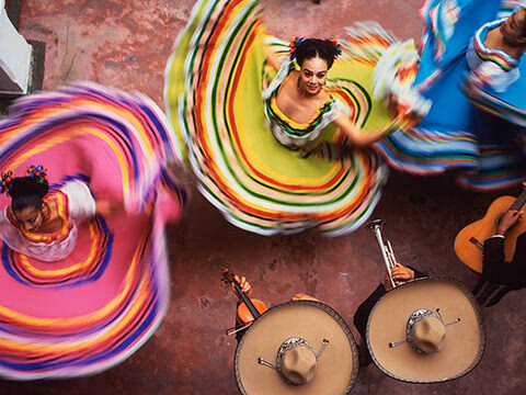 Overhead view of dancers in colorful skirts during luxury special occasion holidays.