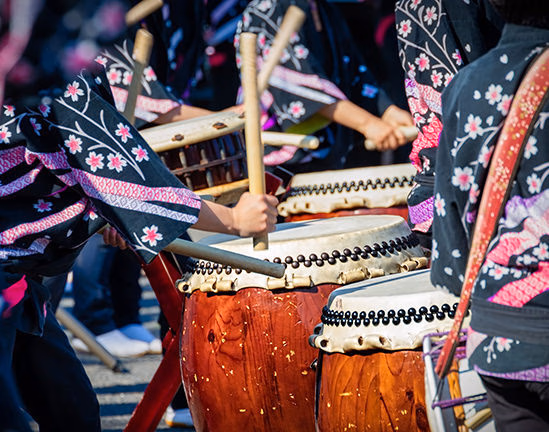 Musicians playing Taiko drums during luxury special occasion trips.
