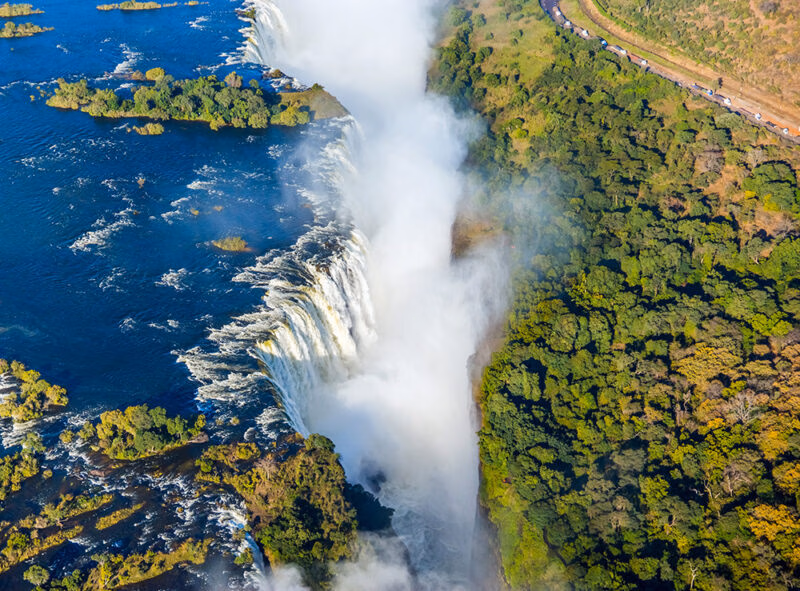 High-angle aerial view of Victoria Falls and the Zambezi River on a luxury Grand Tours of Africa.