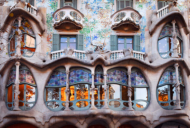 Casa Batllo, a Gaudi-designed building with colourful walls and ornate wavy balconies in Barcelona