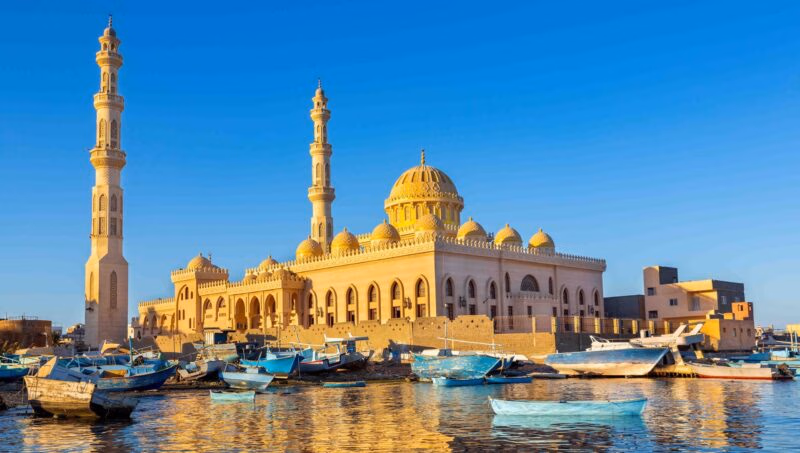 Mosque with fishing boats at sea in egypt