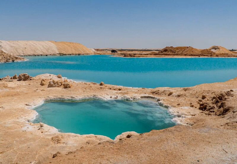 Luxury Egypt Tours - Bright blue natural pools in rocky landscape