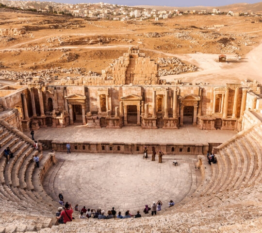 Large South Theatre - in antique town Jerash, Jordan with visiting tourists