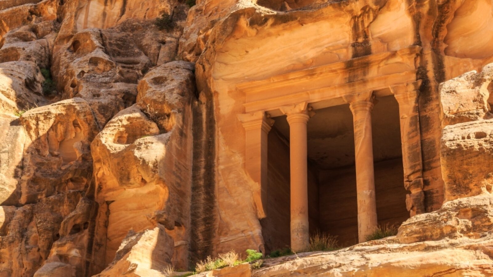 Carved buildings of Little Petra in Siq al-Barid, Wadi Musa, Jordan at daytime