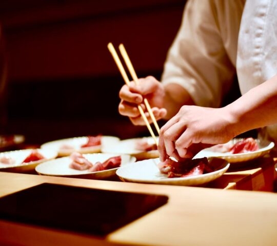 Enjoy a traditional kaiseki dinner, as shown being prepared