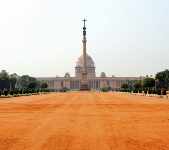 Rashtrapati Bhavan India, with bright orange hues and a clear sky