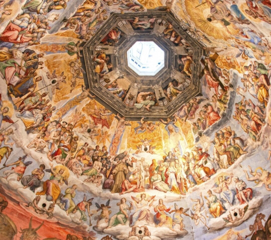 Colorful religious frescoes decorate the interior of a large octagonal dome with a central skylight.