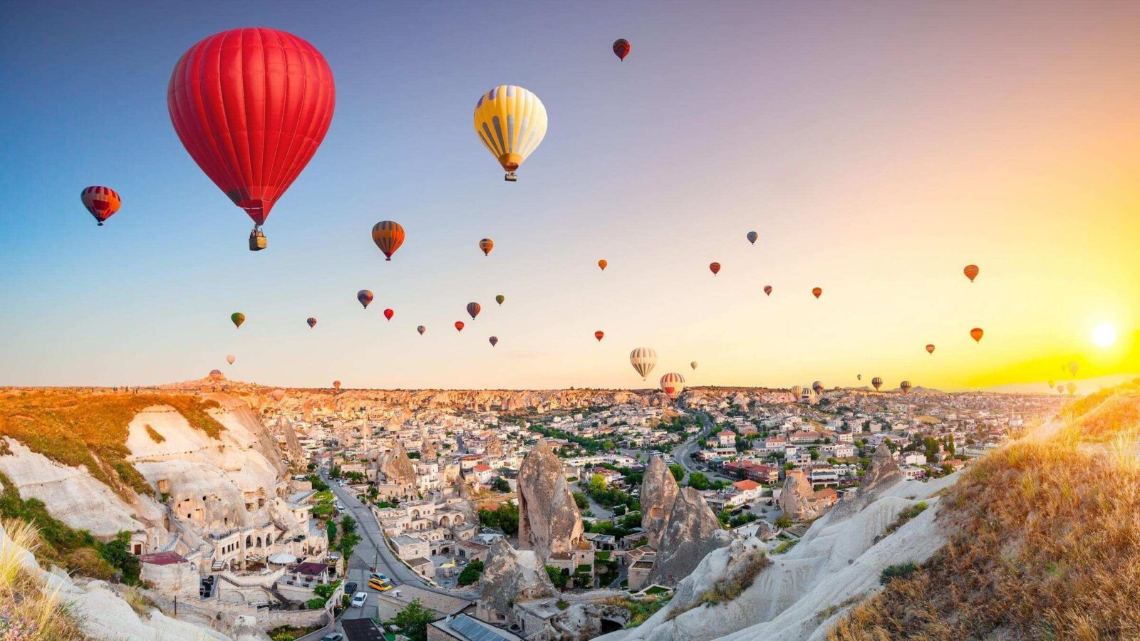 Hot air balloons flying over spectacular Cappadocia