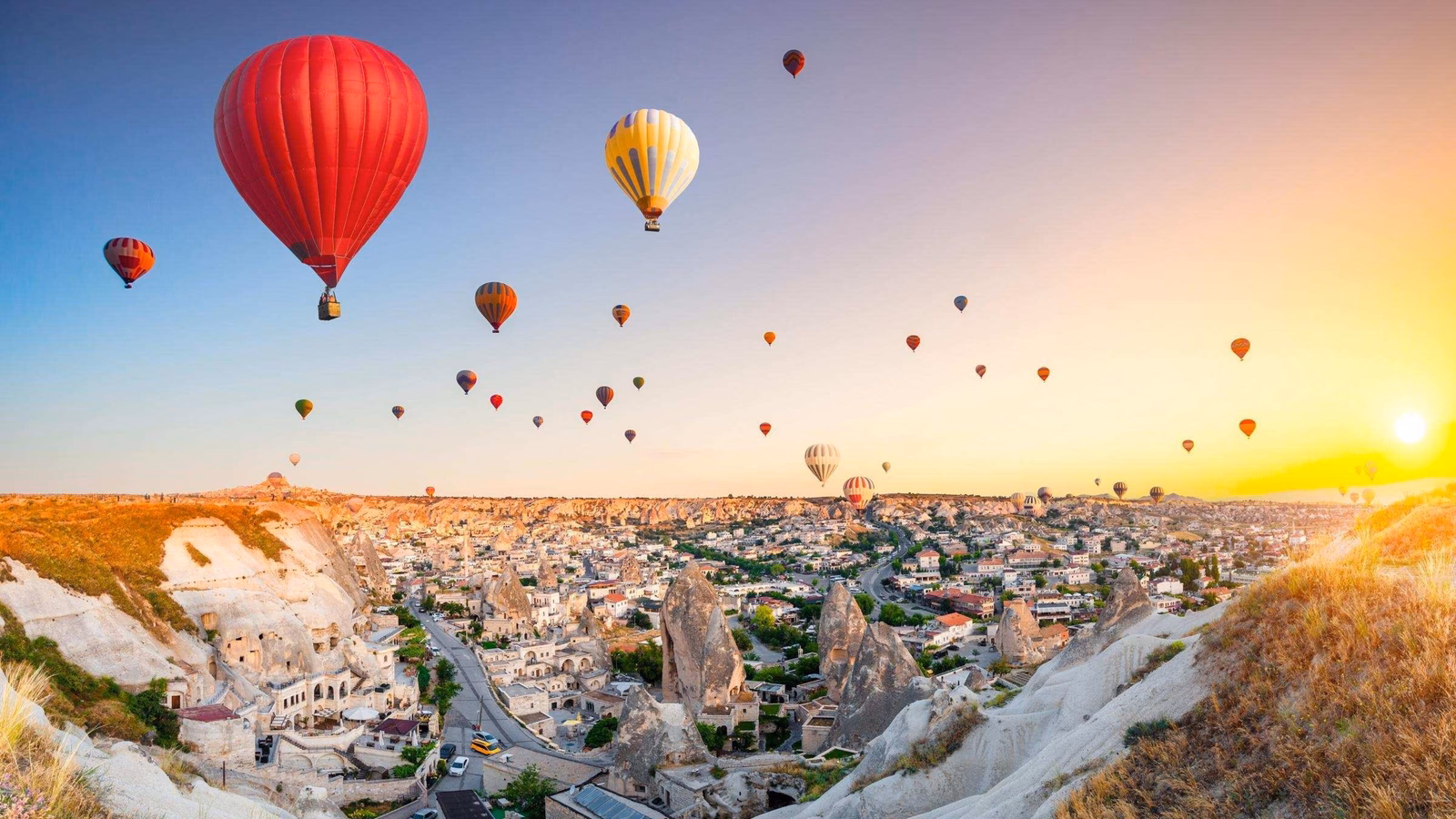 Hot air balloons flying over spectacular Cappadocia