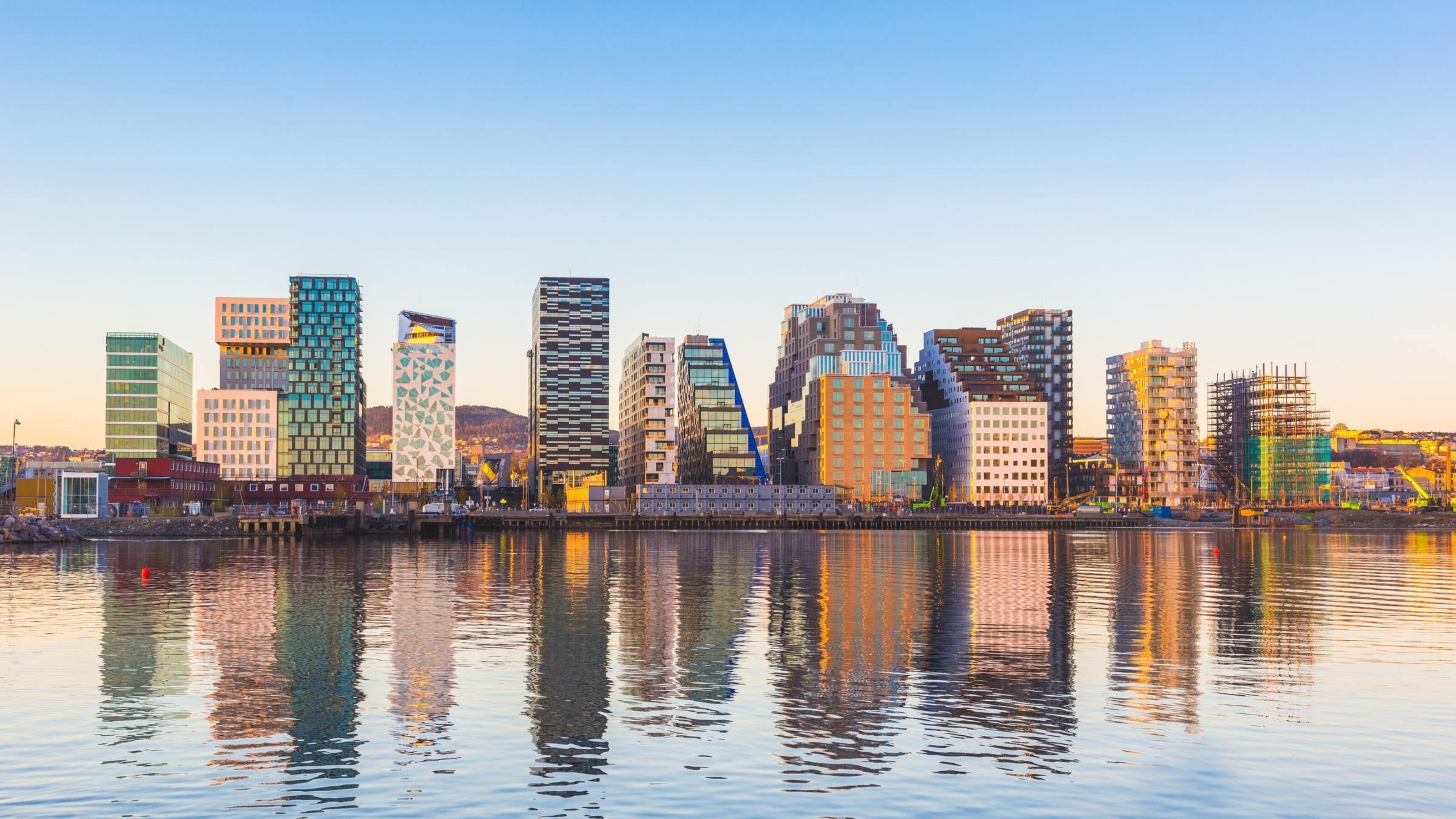 Modern buildings in Oslo, Norway, with their reflection into the water.