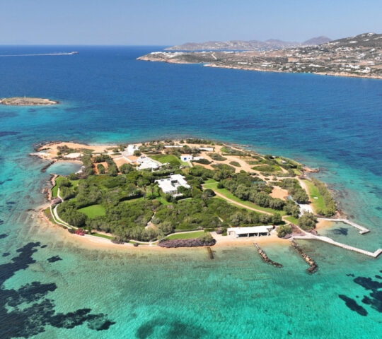 Aerial drone photo of small tropical islet of Revmatonisi near main village and port Antiaparos island, Cyclades, Greece