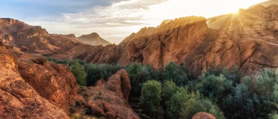 The sun setting over a mountain ridge called Monkey Fingers in the Atlas Mountains
