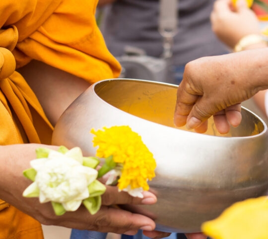 Giving alms to monks in Luang Prabang, Laos