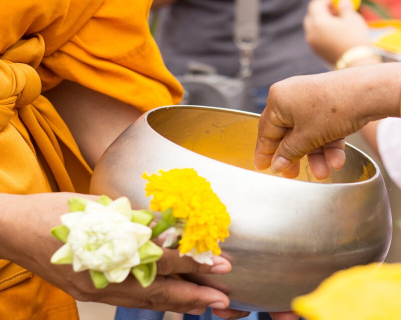 Giving alms to monks in Luang Prabang, Laos