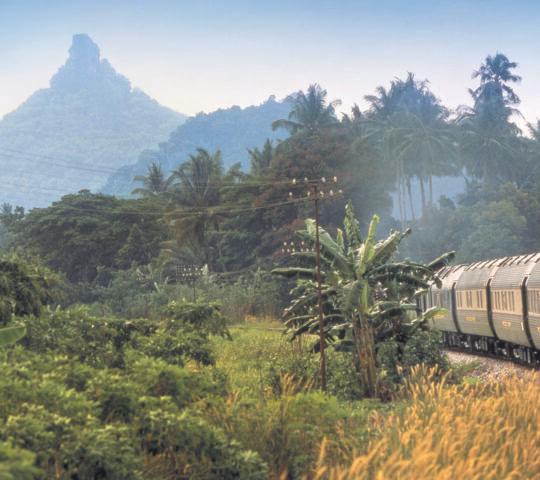 The Belmond Eastern and Oriental Express travelling through the jungle