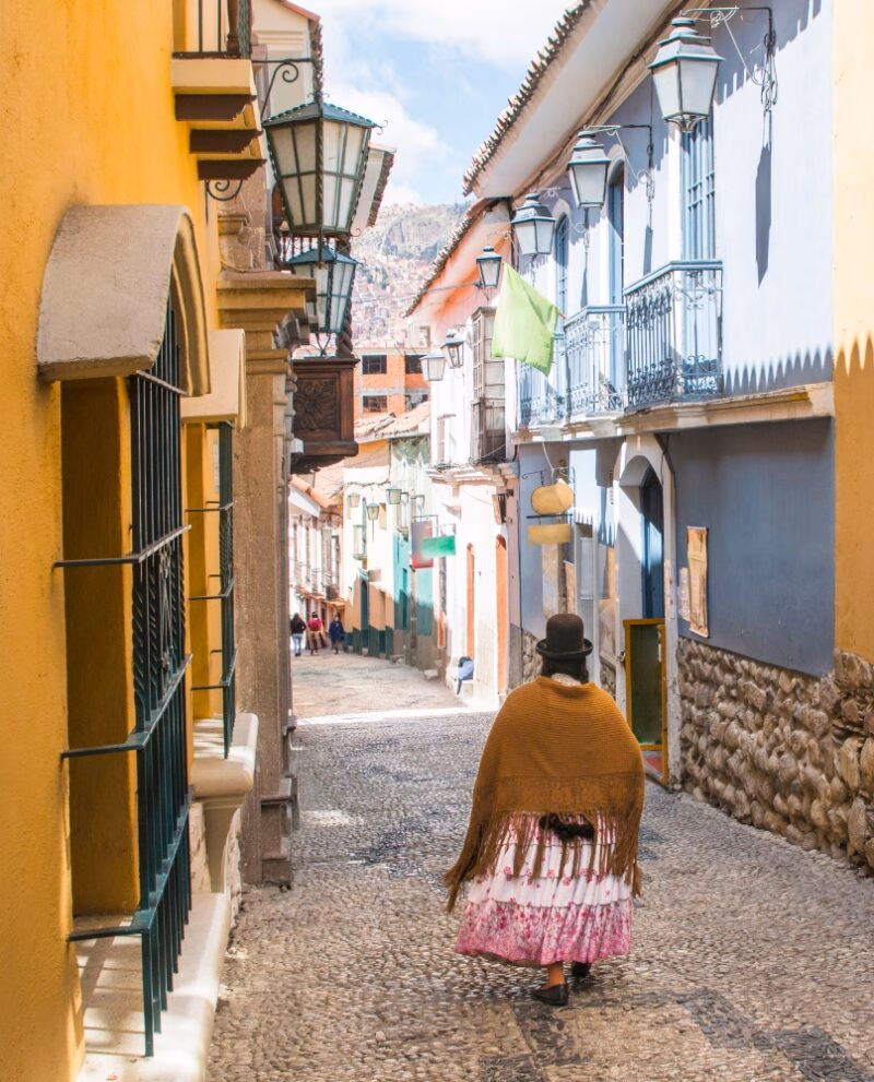 Jaen Street in La Paz, Bolivia city center on a bright summer day. Cholita walking down the street