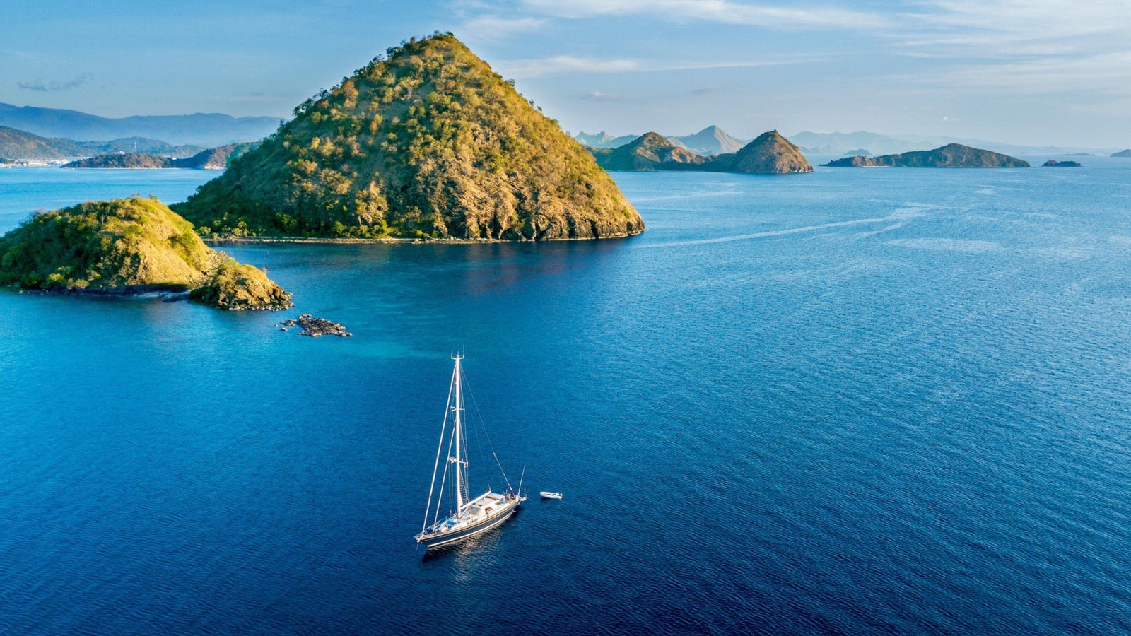 Aerial view of sailboat with island in Labuan Bajo near Bali Island, Indonesia