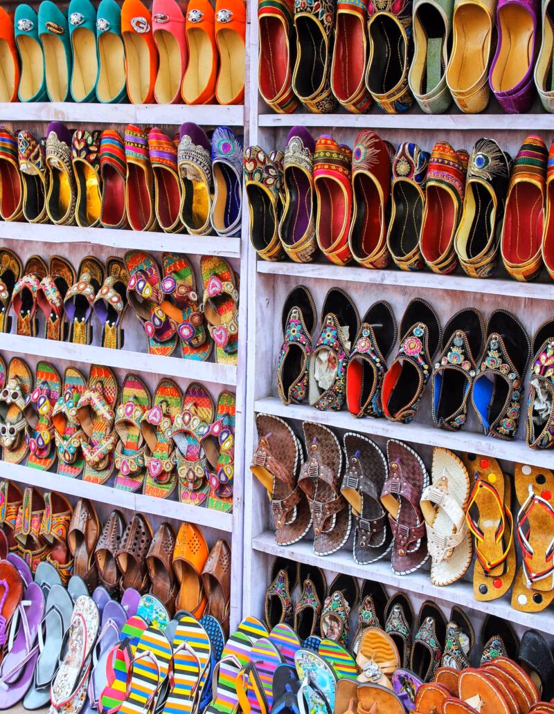 Display of shoes at the street market in Taj Ganj neighborhood of Agra, Uttar Pradesh, India. Agra is one of the most populous cities in Uttar Pradesh