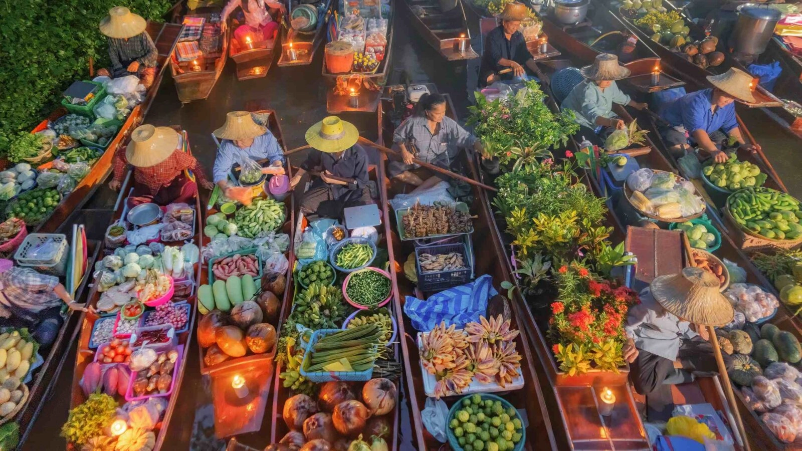 Damnoen Saduak Floating Market or Amphawa. Local people sell fruits, traditional food on boats in canal, Ratchaburi District, Thailand.