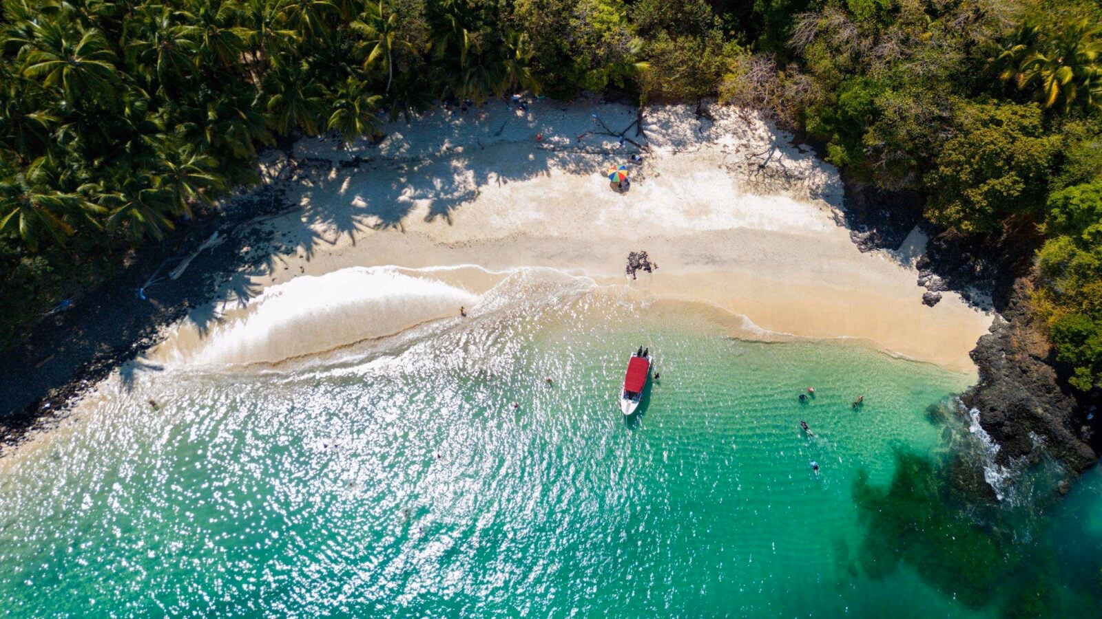 Aerial view of a beach with a small boat in the Gulf of Chiriquí, Panama