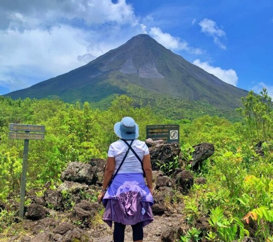 hiking tours - woman hiking near volcano