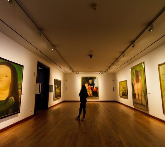 Bogota, Colombia - January 2, 2023: Female visitor looks at Botero's version of Da Vinci's Mona Lisa