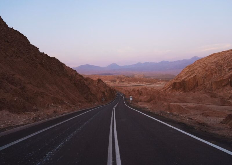 Landscape shot during sunset of road crossing mountains in Atacama desert, Chile