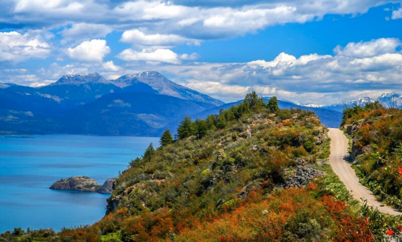 Gravel road called Carretera Austral passing along the shore of a beautiful lake General Carrera in the reomte part of southern Patagonia, Chile