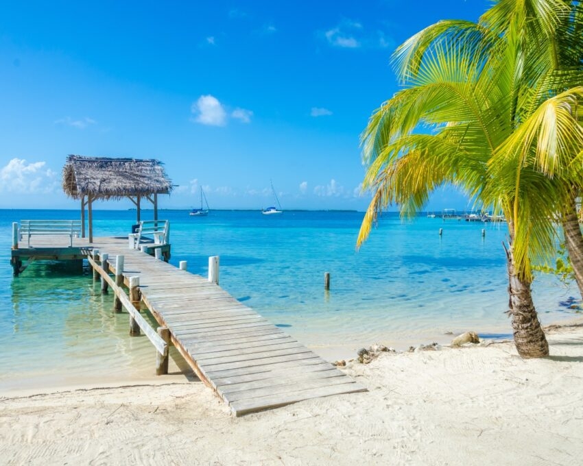 Belize Cayes - Pier on small tropical island at Barrier Reef with paradise beach - known for diving, snorkeling and relaxing vacations - Caribbean Sea, Belize, Central America