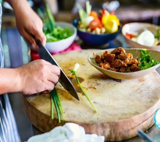 Chef making traditional cambodian meat dish at cooking class
