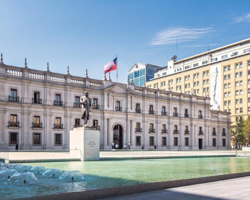Santiago skyline at Araucano Park and chemamules traditional mapuche sculptures - Santiago, Chile