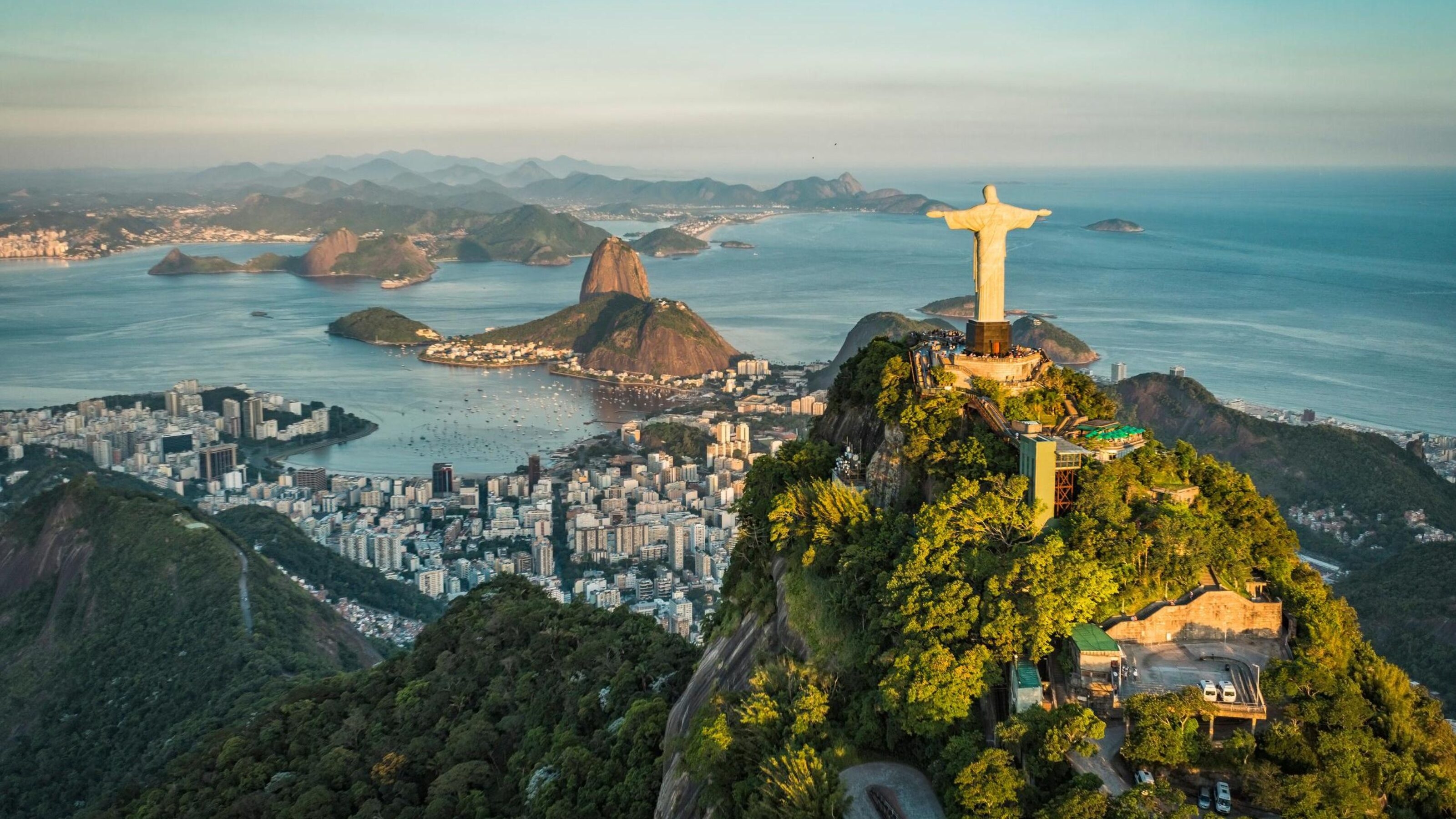 Aerial view of Christ and Botafogo Bay from high angle.