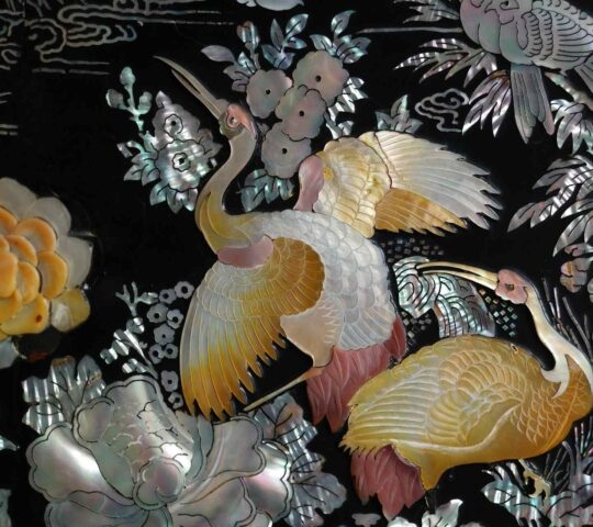 lacquerware inlaid with mother-of-pearl: A wooden dish or furniture decorated by attaching seashell pieces of a fine color in different shapes and then lacquering them