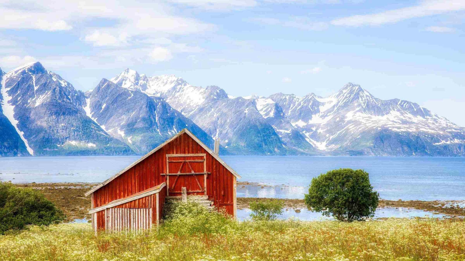 Old Barn near Skittehollet in Lyngenfjord, with the Famous Lyngen Alps Mountain Range, in the Northern Part of Norway